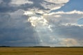 Sunbeams through heavy storm clouds Royalty Free Stock Photo
