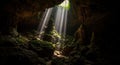 Sunbeams Illuminating a Moss- Covered Rock Formation Inside a Dark Cave cavern underground Royalty Free Stock Photo
