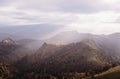 Sunbeams over mountain ridge.