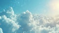 Sunbeams piercing through cumulus clouds in a blue sky. Weather and atmosphere concept for design and print