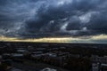 Sunbeams shine through dark ominous storm clouds over midtown Atlanta