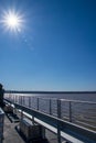 Sunbeams shine over tour boat traveling on the Potomac River