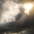 Sunbeams through storm clouds