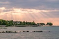 Sunbeams or sun rays at a sunrise on a beach in Sunny Beach on the Black Sea coast of Bulgaria