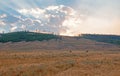 Sunbeams and sunrays through sunset clouds in the Hayden Valley in Yellowstone National Park in Wyoming Royalty Free Stock Photo