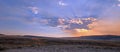 Sunbeams and sunrays through sunset clouds in the Hayden Valley in Yellowstone National Park in Wyoming Royalty Free Stock Photo