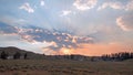 Sunbeams and sunrays through sunset clouds in the Hayden Valley in Yellowstone National Park in Wyoming Royalty Free Stock Photo