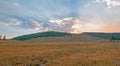 Sunbeams and sunrays through sunset clouds in the Hayden Valley in Yellowstone National Park in Wyoming Royalty Free Stock Photo