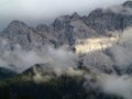 Sunbeam and clouds at mountain massif Royalty Free Stock Photo