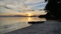 SunBeautiful Sunset on Sea Boat in White Sand Beach Royalty Free Stock Photo