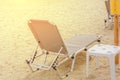 Sunbed close on beach background with burning sun Royalty Free Stock Photo