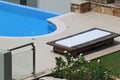 Sunbed for relaxation next to the pool Royalty Free Stock Photo