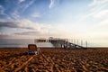 Sunbed on the sand beach and view to water of sea, pierce and blue sky with white clouds in a nice day, morning or evening. The Royalty Free Stock Photo