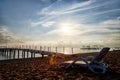 Sunbed on the sand beach and view to water of sea, pierce and blue sky with white clouds in a nice day, morning or evening. The Royalty Free Stock Photo