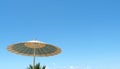 Sunbed umbrella on the beach and blue sky