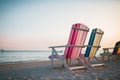 Sunbeds on the beach. Blue sea and white sand. Generative Ai Royalty Free Stock Photo