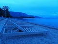 Sunbeds on the beach at the bluehour, background Royalty Free Stock Photo