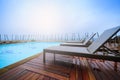 Sunbeds chairs near swimming pool Royalty Free Stock Photo