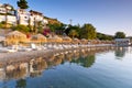 Sunbeds with parasols at Mirabello Bay on Crete Royalty Free Stock Photo