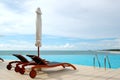 Sunbeds at the sea view swimming pool Royalty Free Stock Photo