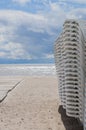 Sunbeds stacked on the beach during stormy weather Royalty Free Stock Photo