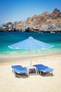 Sunbeds and umbrella on the beach Royalty Free Stock Photo