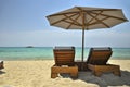 Sunbeds and umbrella on the beach Royalty Free Stock Photo