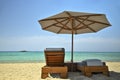 Sunbeds and umbrella on beautiful beach Royalty Free Stock Photo