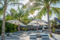 Sunbeds and umbrellas near beach at the tropical resort island Royalty Free Stock Photo