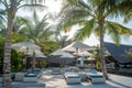 Sunbeds and umbrellas near beautiful beach at the tropical resort island Royalty Free Stock Photo