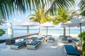 Sunbeds and umbrellas near swimming pool at beach Royalty Free Stock Photo