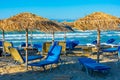 Sunbeds and umbrellas at Sidari beach at Corfu, Greece Royalty Free Stock Photo