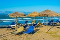 Sunbeds and umbrellas at Sidari beach at Corfu, Greece Royalty Free Stock Photo