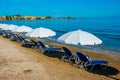 Sunbeds and umbrellas at Sidari beach at Corfu, Greece Royalty Free Stock Photo