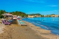 Sunbeds and umbrellas at Sidari beach at Corfu, Greece Royalty Free Stock Photo