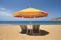 sunbeds under a parasol on a sandy beachfront