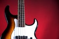 Sunburst Bass Guitar Isolated On Red Royalty Free Stock Photo