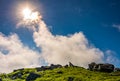 Sunburst on a blue sky with clouds over the mountains Royalty Free Stock Photo