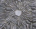 Sunburst design with stones in concrete wall texture Royalty Free Stock Photo