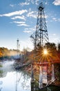 Sunburst oil derricks Royalty Free Stock Photo