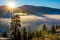 Sunburst over valley inversion fog Royalty Free Stock Photo