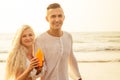 Suncare couple on a summer beach vacation have good skincare with high spf sunblock suncream. Handsome man sun tan Royalty Free Stock Photo