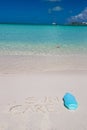 Suncare written on tropical white sand and Royalty Free Stock Photo