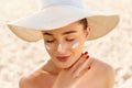Suncream. Suntan Lotion Beautiful Woman Applying on beautiful on Face. Sunscreen Solar Cream. Skin care Royalty Free Stock Photo