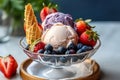 Sundae heaven: Delicious ice cream with waffle cone, blueberries and strawberries in bowl Royalty Free Stock Photo