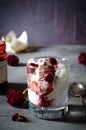 Sundae Ice cream with cherry in chocolate topping, and dried rose flowers on dark background. Love, Valentine`s day
