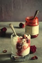 Sundae Ice cream with cherry in chocolate topping, and dried rose flowers on dark background. Love, Valentine`s day