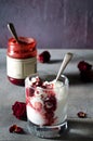 Sundae Ice cream with cherry in chocolate topping, and dried rose flowers on dark background. Love, Valentine`s day