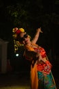 a Sundanese dancer dances very agilely while wearing sunglasses on her face