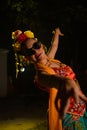 a Sundanese dancer dances very agilely while wearing sunglasses on her face